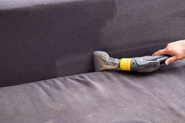 Removing deep stains from a fabric couch using steam.
